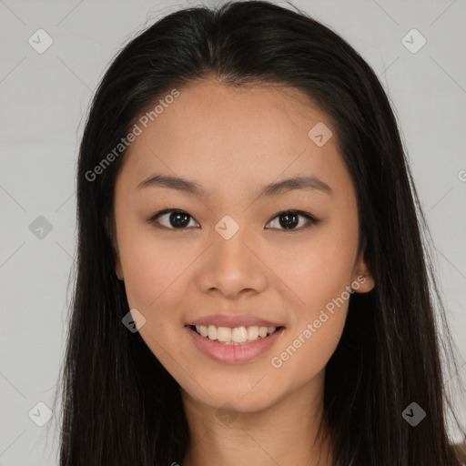 Joyful asian young-adult female with long  brown hair and brown eyes