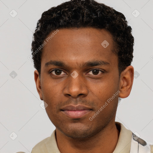 Neutral black young-adult male with short  brown hair and brown eyes