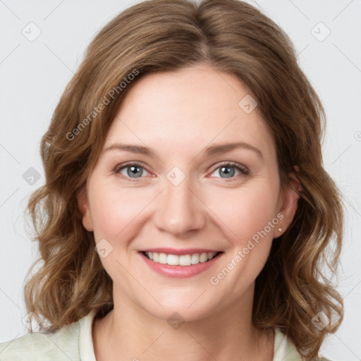 Joyful white young-adult female with medium  brown hair and green eyes