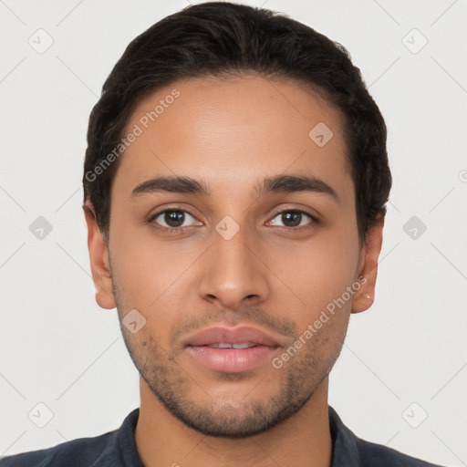 Neutral latino young-adult male with short  brown hair and brown eyes