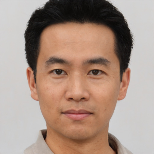 Neutral asian young-adult male with short  black hair and brown eyes