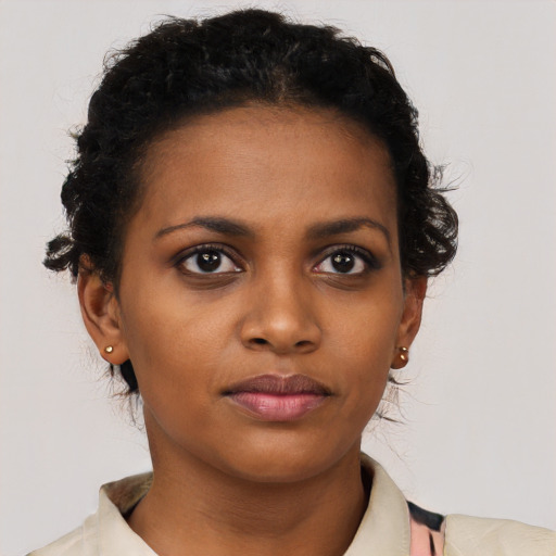 Neutral black young-adult female with short  black hair and brown eyes
