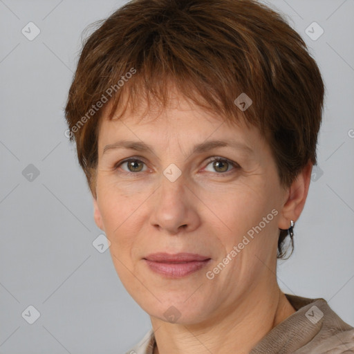 Joyful white adult female with short  brown hair and grey eyes