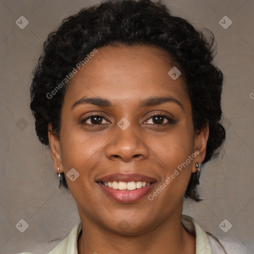 Joyful black young-adult female with medium  brown hair and brown eyes