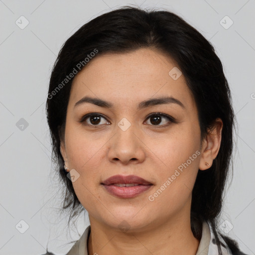 Joyful latino young-adult female with medium  black hair and brown eyes