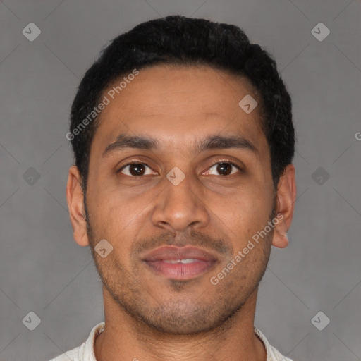 Joyful latino young-adult male with short  black hair and brown eyes