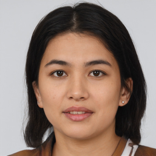 Joyful asian young-adult female with medium  brown hair and brown eyes