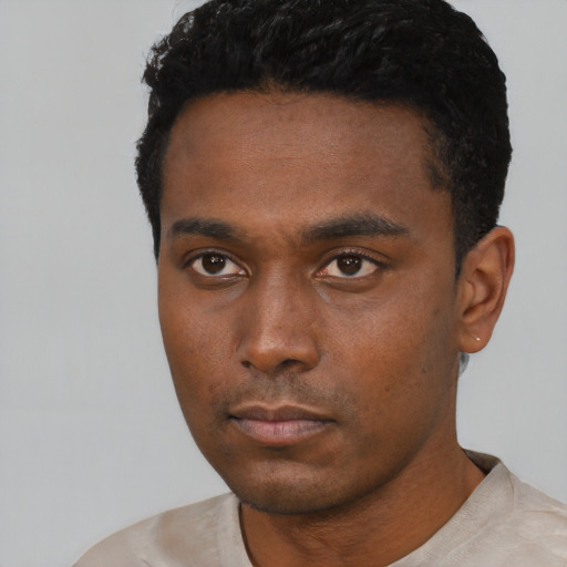 Neutral black young-adult male with short  black hair and brown eyes