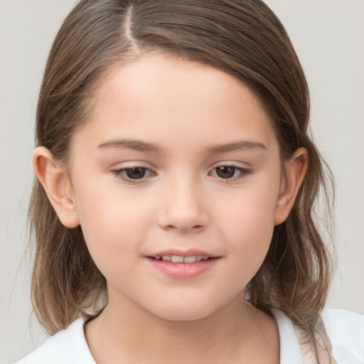 Joyful white child female with medium  brown hair and brown eyes