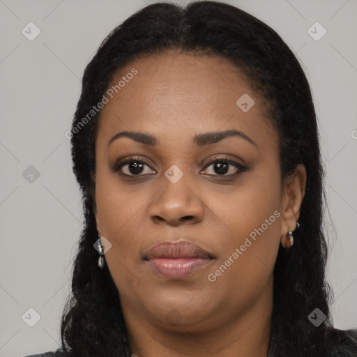 Joyful black young-adult female with long  black hair and brown eyes