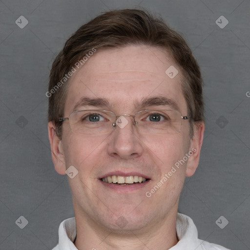 Joyful white adult male with short  brown hair and grey eyes