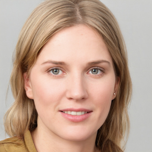 Joyful white young-adult female with medium  brown hair and blue eyes