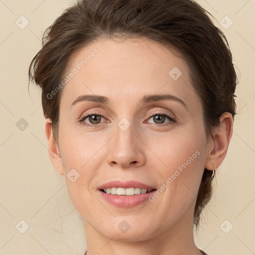 Joyful white young-adult female with medium  brown hair and green eyes