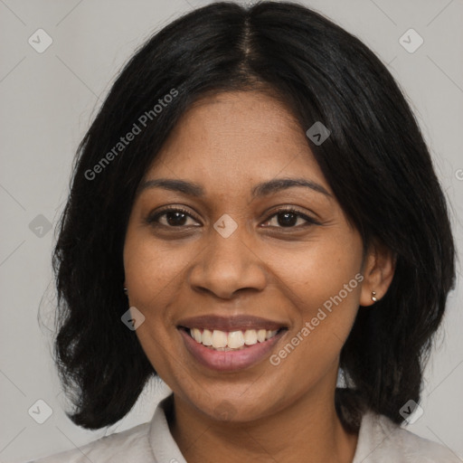 Joyful black adult female with medium  black hair and brown eyes