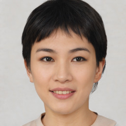 Joyful asian young-adult female with short  brown hair and brown eyes