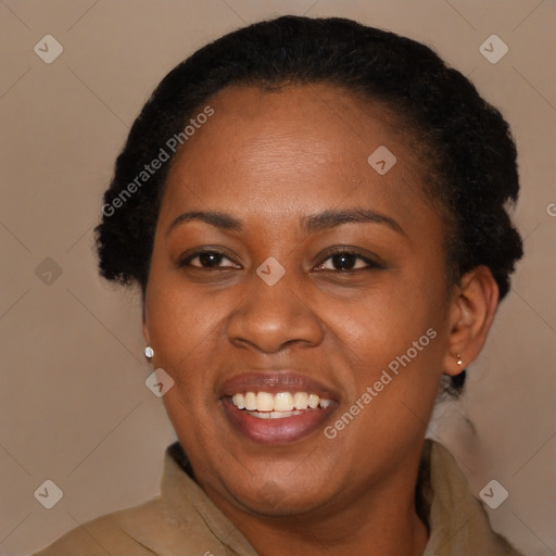 Joyful black young-adult female with long  brown hair and brown eyes