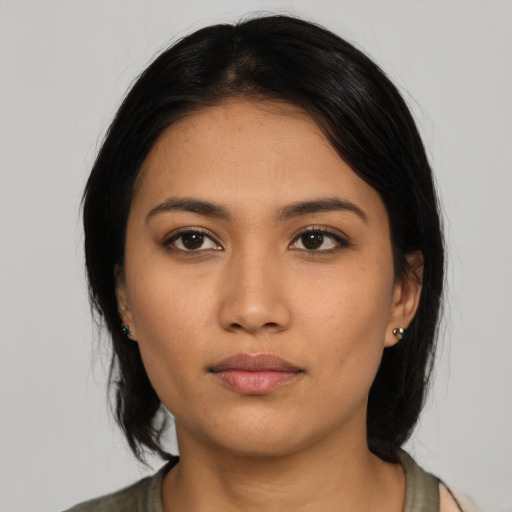 Neutral latino young-adult female with medium  black hair and brown eyes