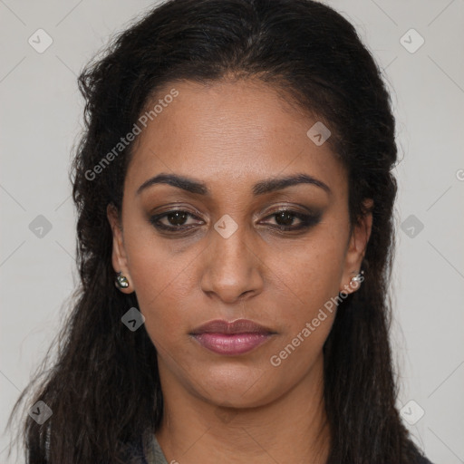 Joyful black young-adult female with long  brown hair and brown eyes