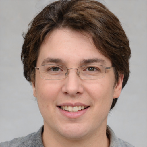 Joyful white adult male with short  brown hair and grey eyes