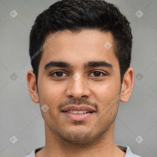 Joyful latino young-adult male with short  black hair and brown eyes