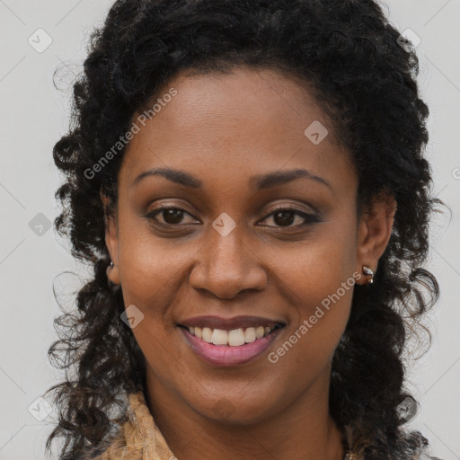 Joyful black young-adult female with long  brown hair and brown eyes