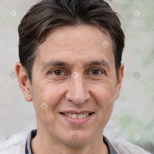 Joyful white adult male with short  brown hair and brown eyes