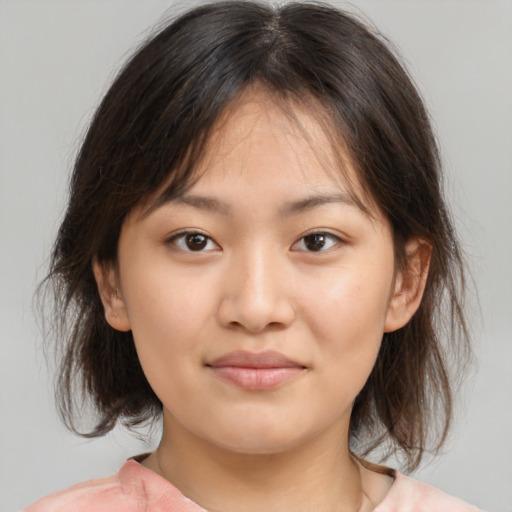 Neutral asian young-adult female with medium  brown hair and brown eyes
