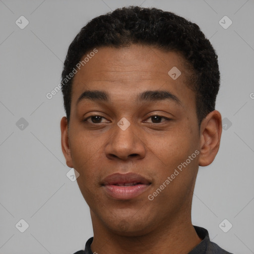 Joyful black young-adult male with short  brown hair and brown eyes