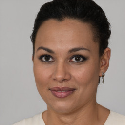 Joyful latino young-adult female with short  brown hair and brown eyes