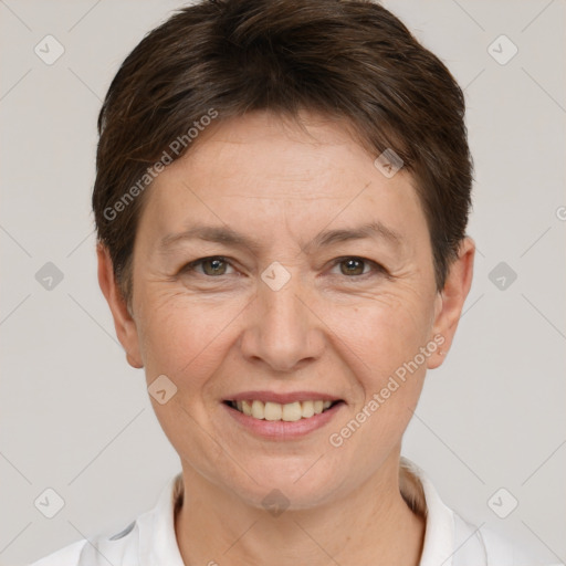 Joyful white adult female with short  brown hair and brown eyes