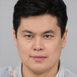 Neutral asian young-adult male with short  brown hair and brown eyes