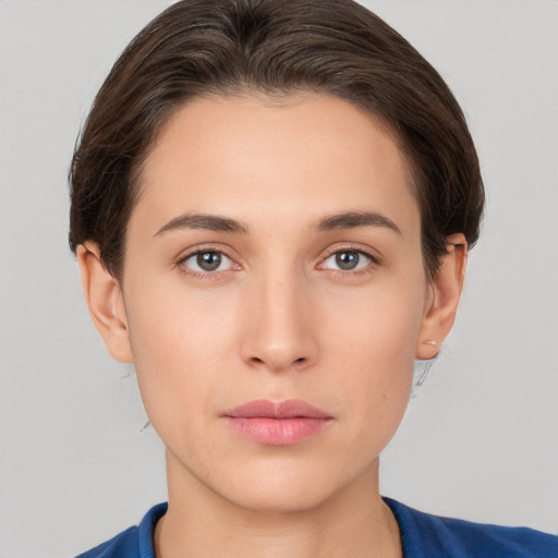 Neutral white young-adult female with short  brown hair and brown eyes