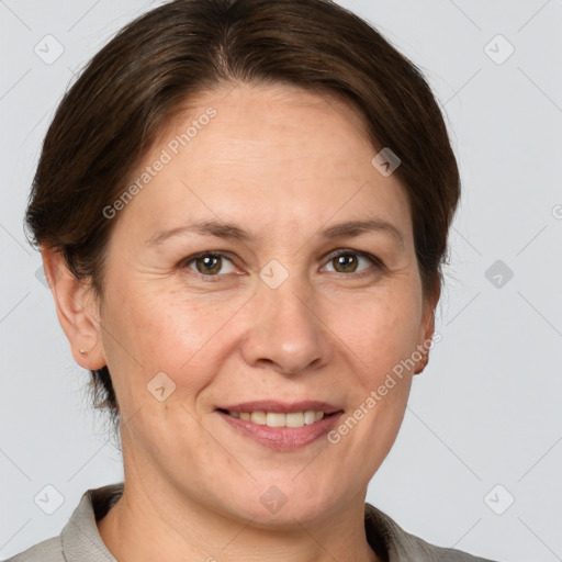 Joyful white adult female with short  brown hair and brown eyes