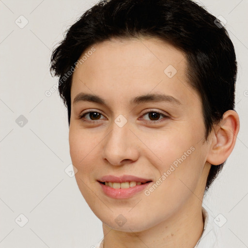 Joyful white young-adult female with short  brown hair and brown eyes