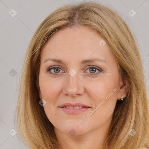 Joyful white adult female with long  brown hair and brown eyes