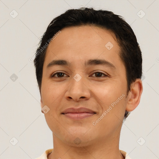 Joyful latino young-adult female with short  brown hair and brown eyes