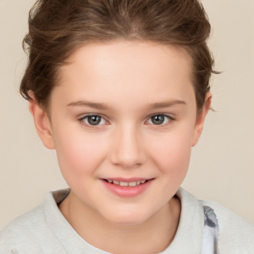 Joyful white child female with short  brown hair and brown eyes