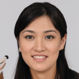 Joyful asian young-adult female with long  black hair and brown eyes