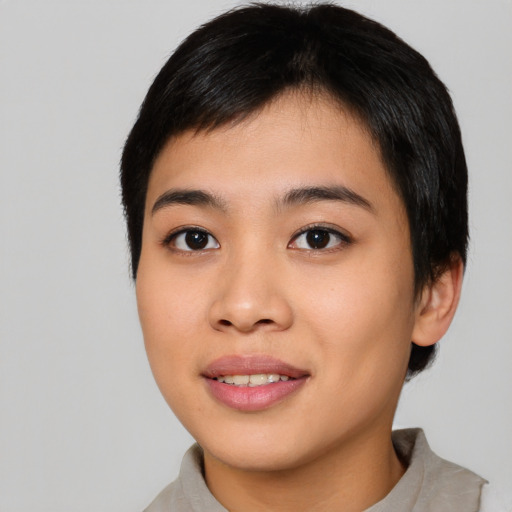 Joyful asian young-adult female with short  brown hair and brown eyes