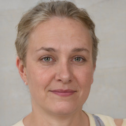 Joyful white adult female with short  brown hair and grey eyes