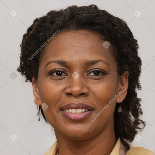 Joyful black adult female with short  brown hair and brown eyes