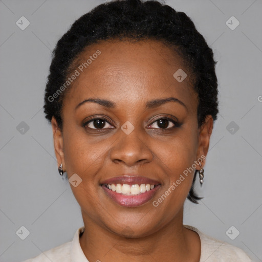 Joyful black young-adult female with short  brown hair and brown eyes