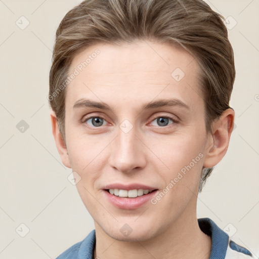 Joyful white young-adult female with short  brown hair and grey eyes