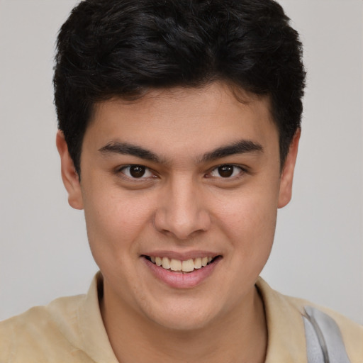 Joyful latino young-adult male with short  brown hair and brown eyes