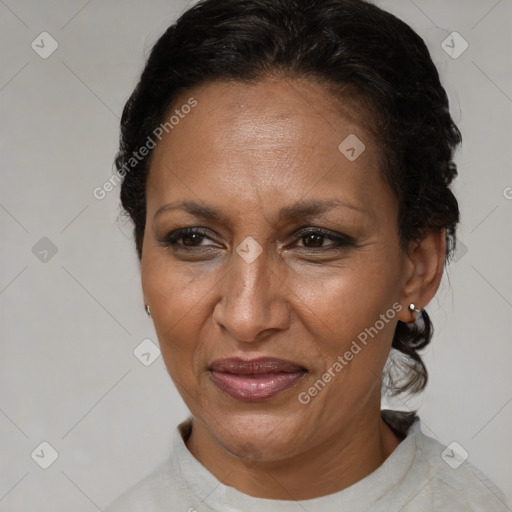 Joyful black adult female with short  brown hair and brown eyes