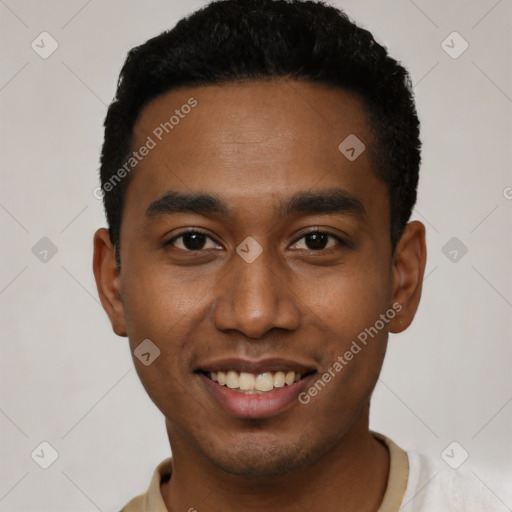 Joyful black young-adult male with short  black hair and brown eyes