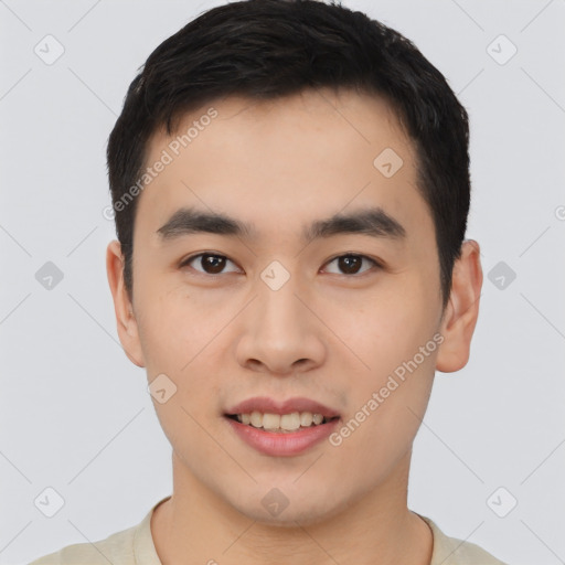 Joyful asian young-adult male with short  black hair and brown eyes