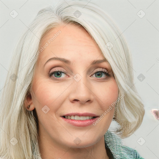 Joyful white adult female with long  brown hair and blue eyes