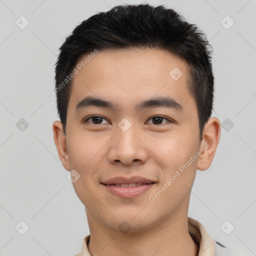 Joyful asian young-adult male with short  black hair and brown eyes