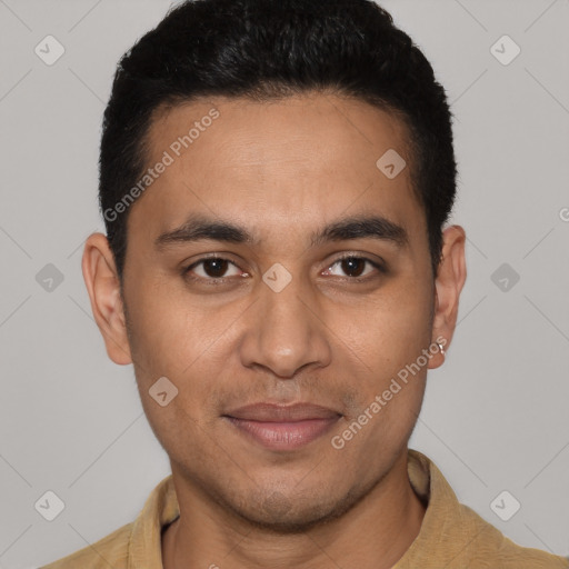 Joyful latino young-adult male with short  black hair and brown eyes